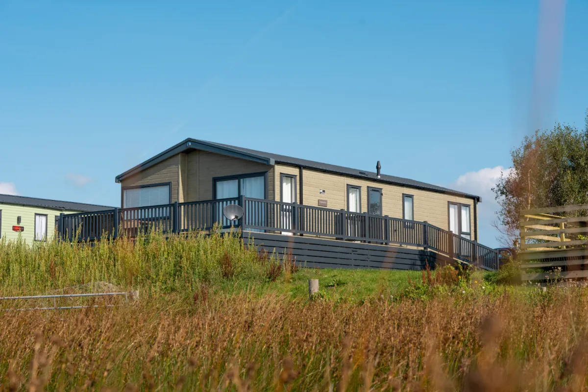 Holiday home with a decked veranda overlooking the estuary at Saltcoats Holiday Park